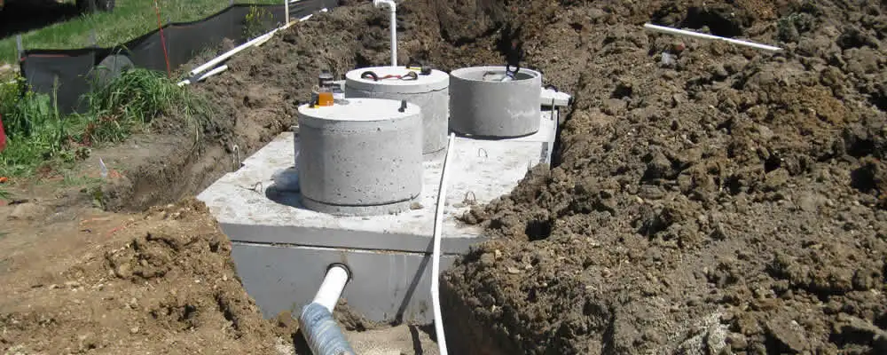 Septic system repair and installation site with tank access ports in Greenville, NC